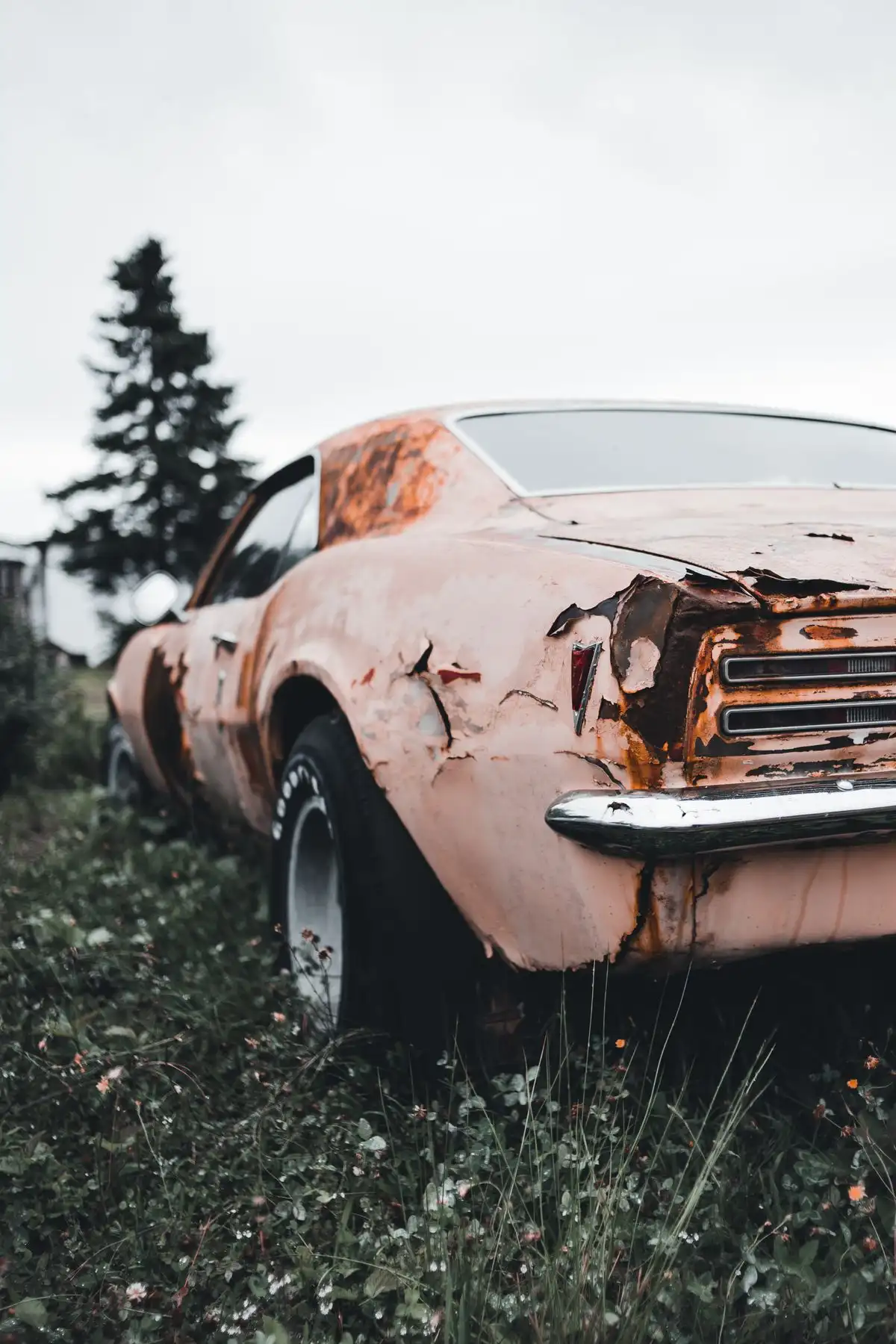 An old car that has been sitting unused, ready for removal
